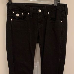 Black True Religion jeans with rhinestone buttons